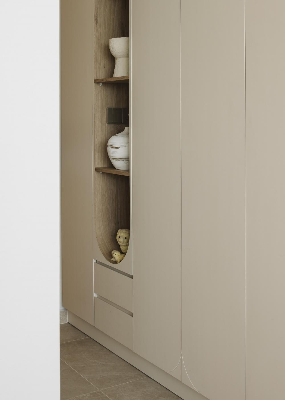 Scandinavian Entryway with Bookshelf and Storage Cabinets