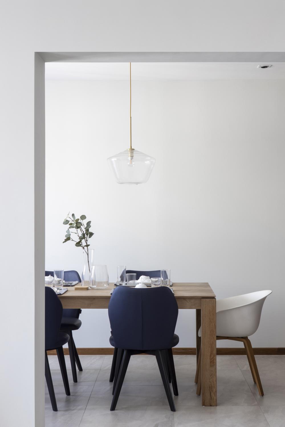 Scandinavian Dining Room with Drop Light and Dining Table