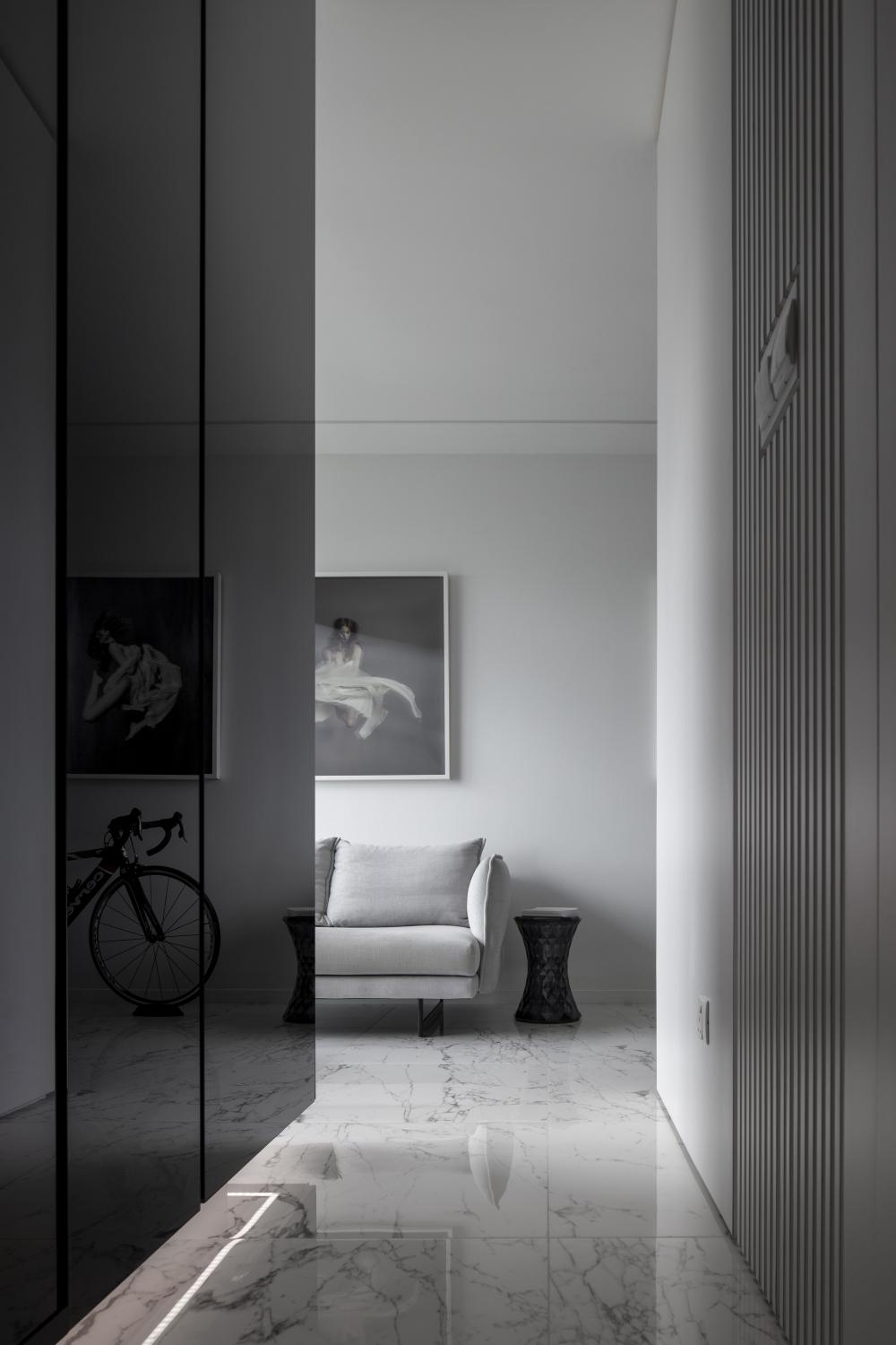 Modern Hallway with Marble Floor and Cove Lighting