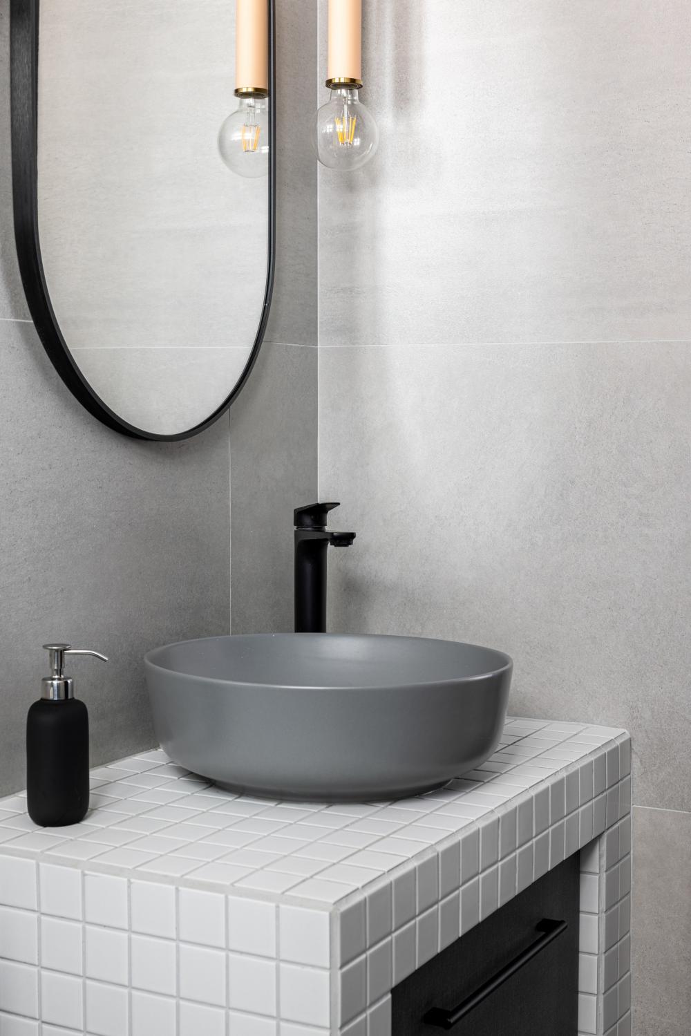 Scandinavian Bathroom with Countertop and Mirror