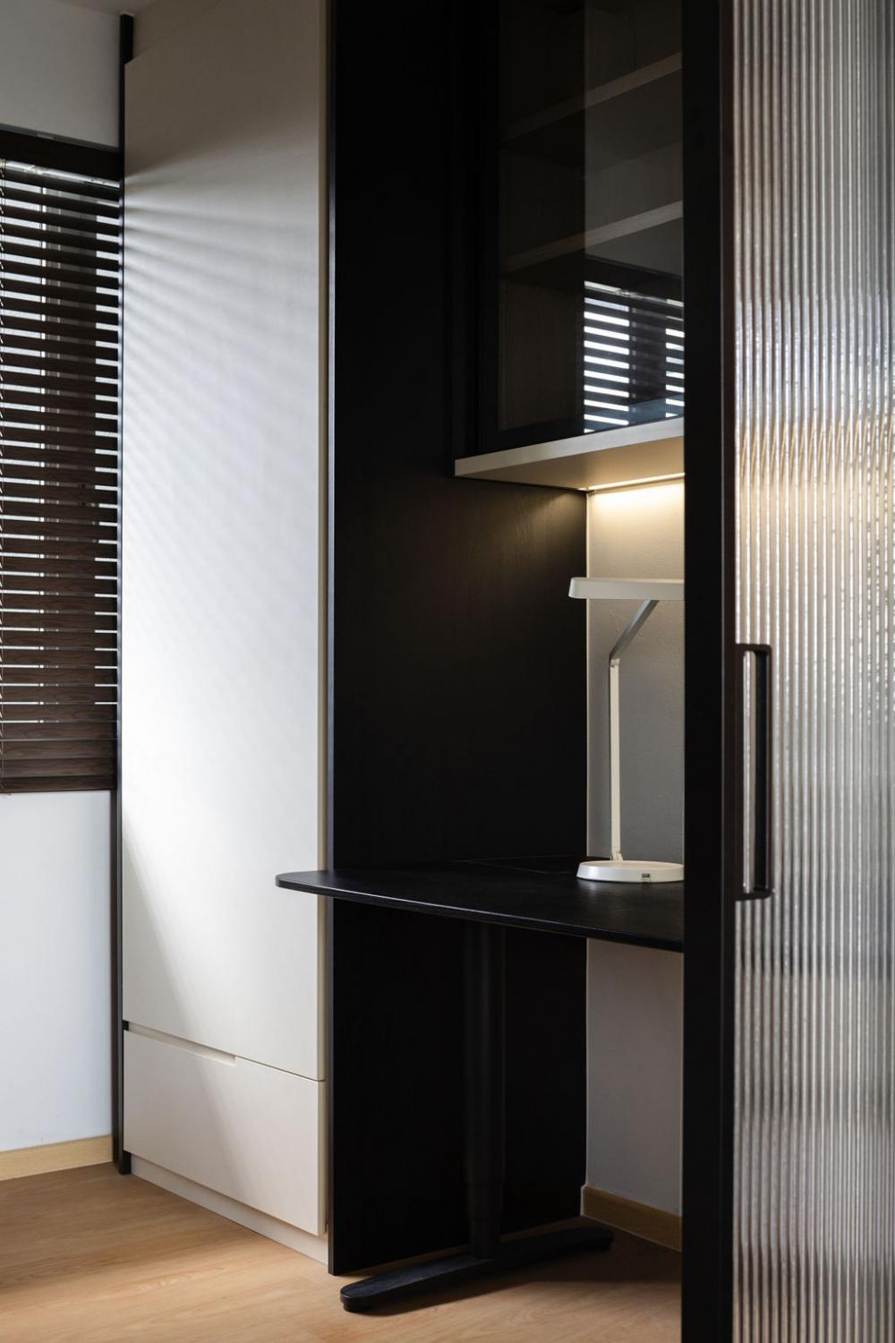 Minimalist Home Office with Glass Door and Storage Cabinets