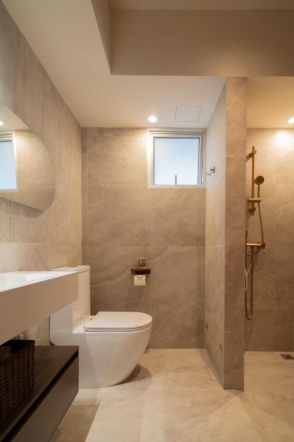 Minimalist Bathroom with Herringbone Tiling and Mirror