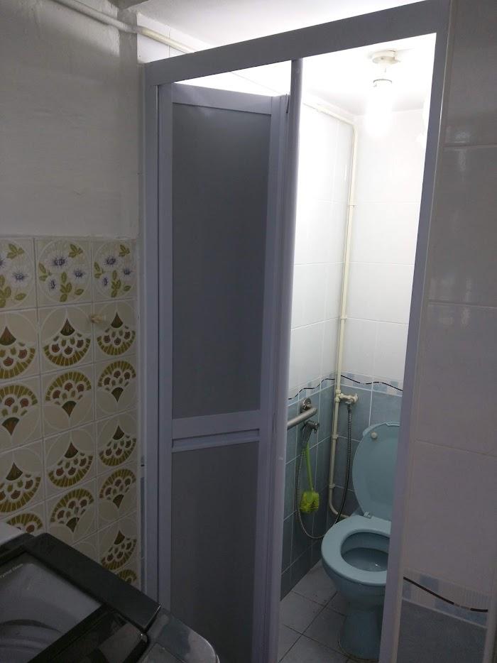 Asian Bathroom with Mirror and Showers