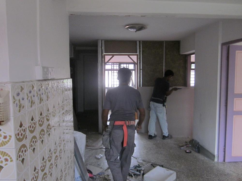 Asian Living Room with Homogeneous Tiles and Feature Wall