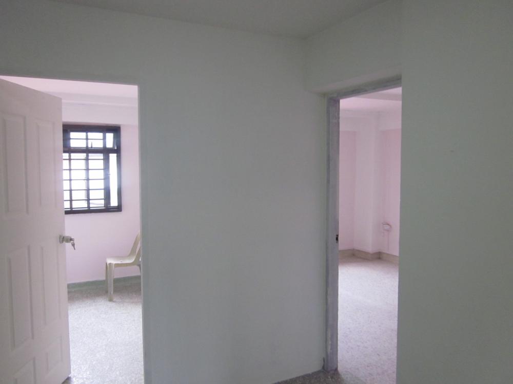 Asian Living Room with TV Console and Feature Wall