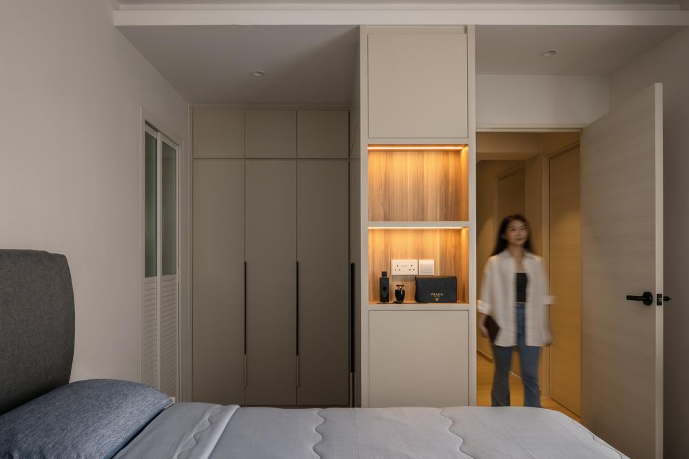 Minimalist Bedroom with Bookshelf and Cove Lighting