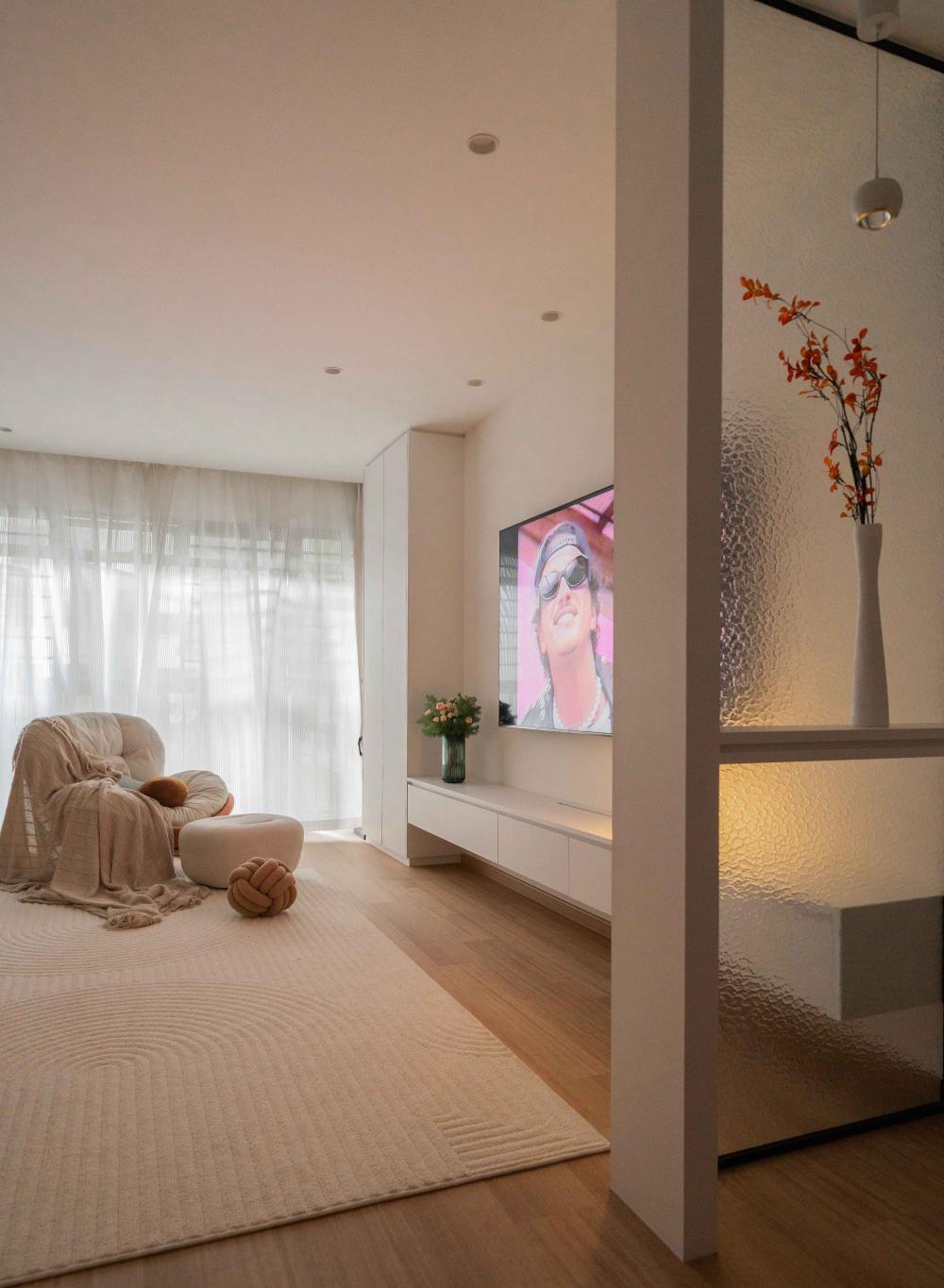 Minimalist Entryway with Wood Flooring and TV Console