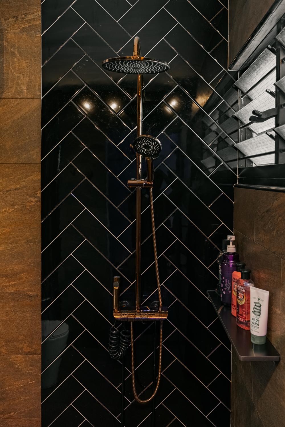 Eclectic Bathroom with Herringbone Tiling and Rainshower