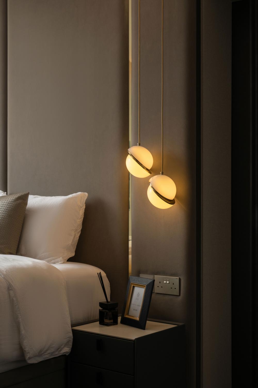 Modern Bedroom with Drop Light and Bedside Table
