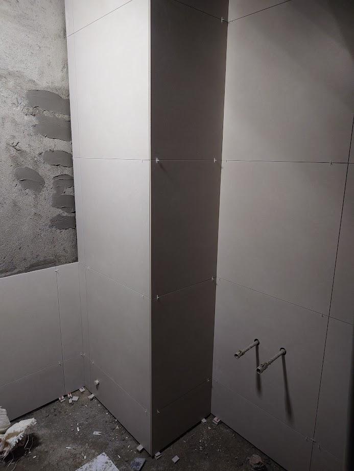 Scandinavian Bathroom with Homogeneous Tiles and Herringbone Tiling