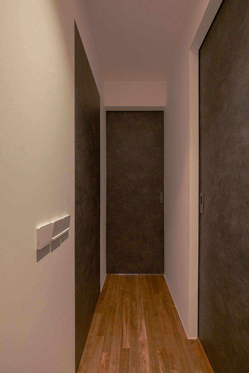Minimalist Hallway with Bookshelf and Artwork