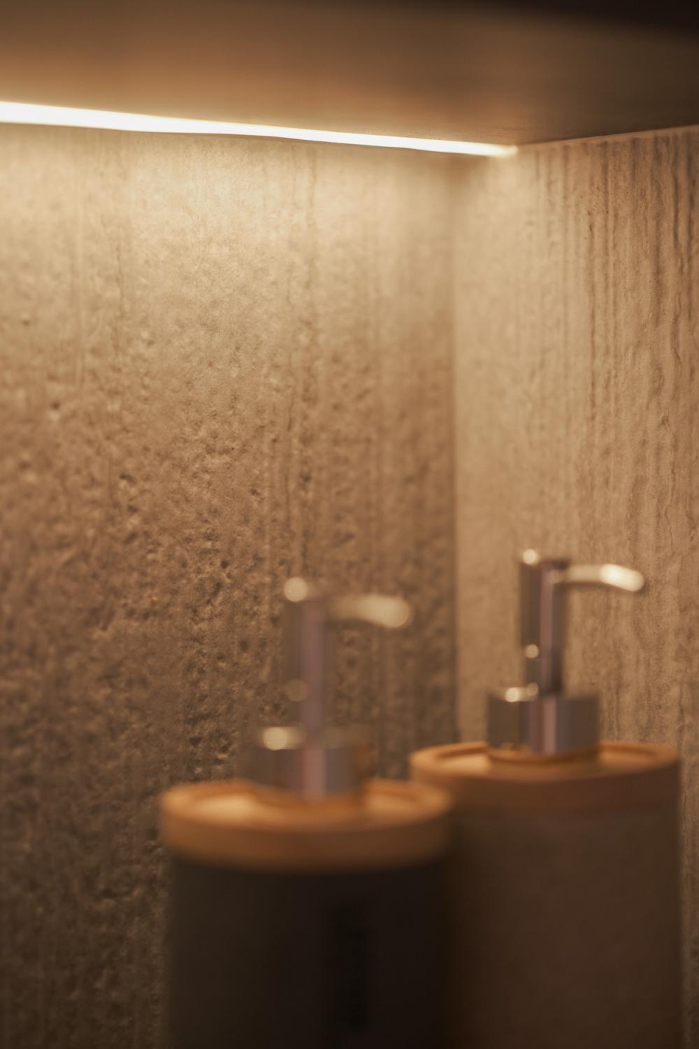 Minimalist Bathroom with Granite Floor and Mirror