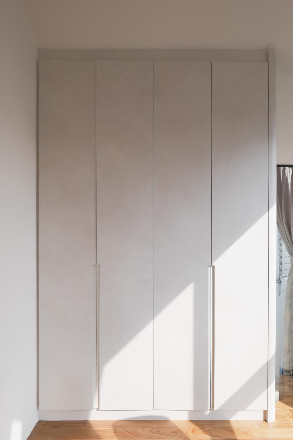Minimalist Bedroom with Parquet Floor and Drop Light