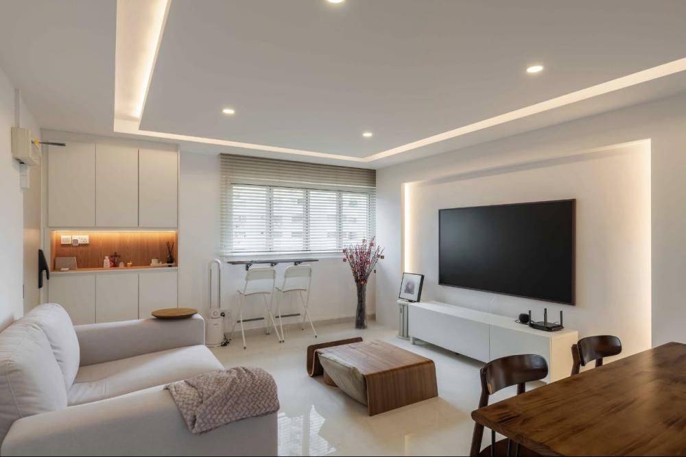 Modern Living Room with Bookshelf and Homogeneous Tiles