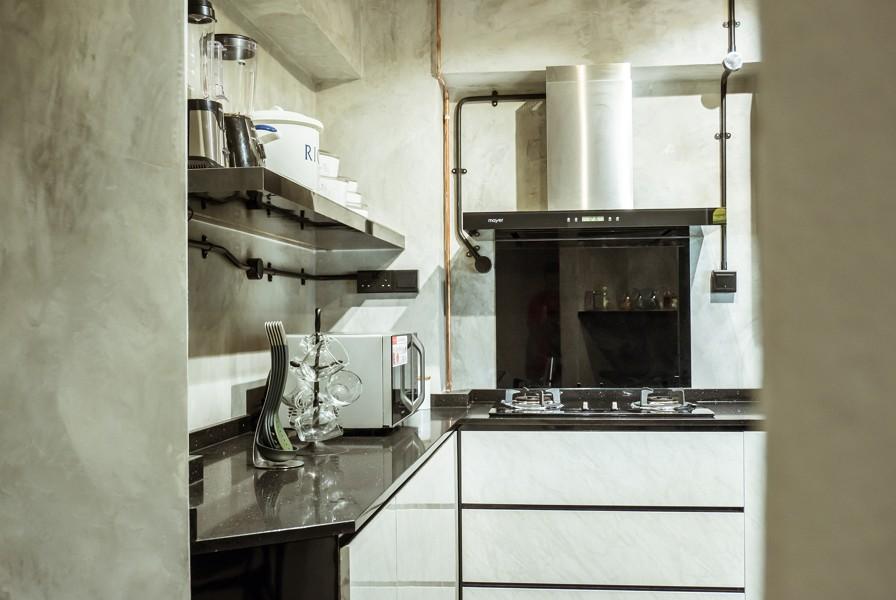 Industrial Kitchen with Countertop and Cupboard