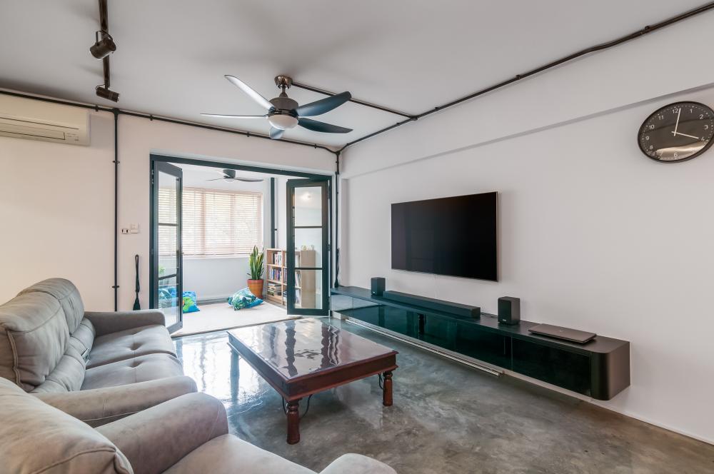 Industrial Living Room with Cement Floor and TV Console