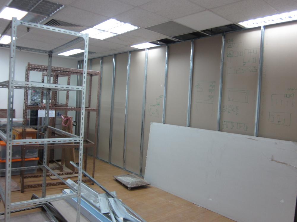 Asian Home Office with Storage Cabinets and Wall Shelves