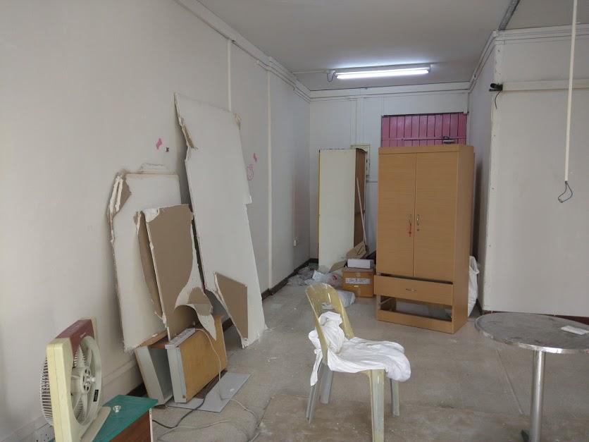 Asian Living Room with Herringbone Tiling and Cement Floor