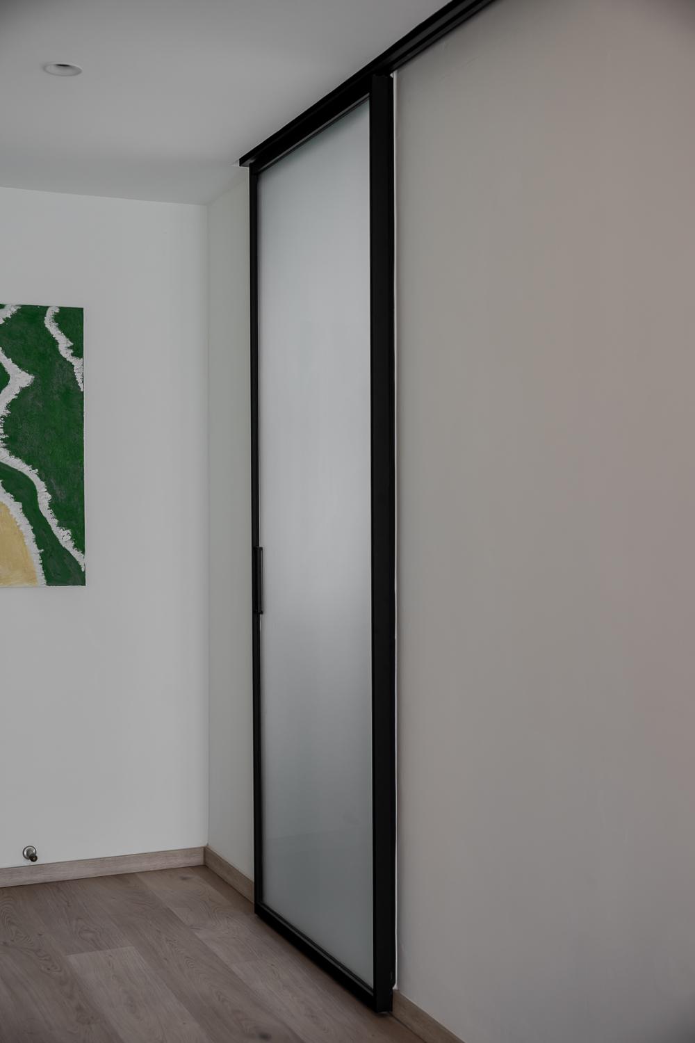 Transitional Entryway with Homogeneous Tiles and Drop Light