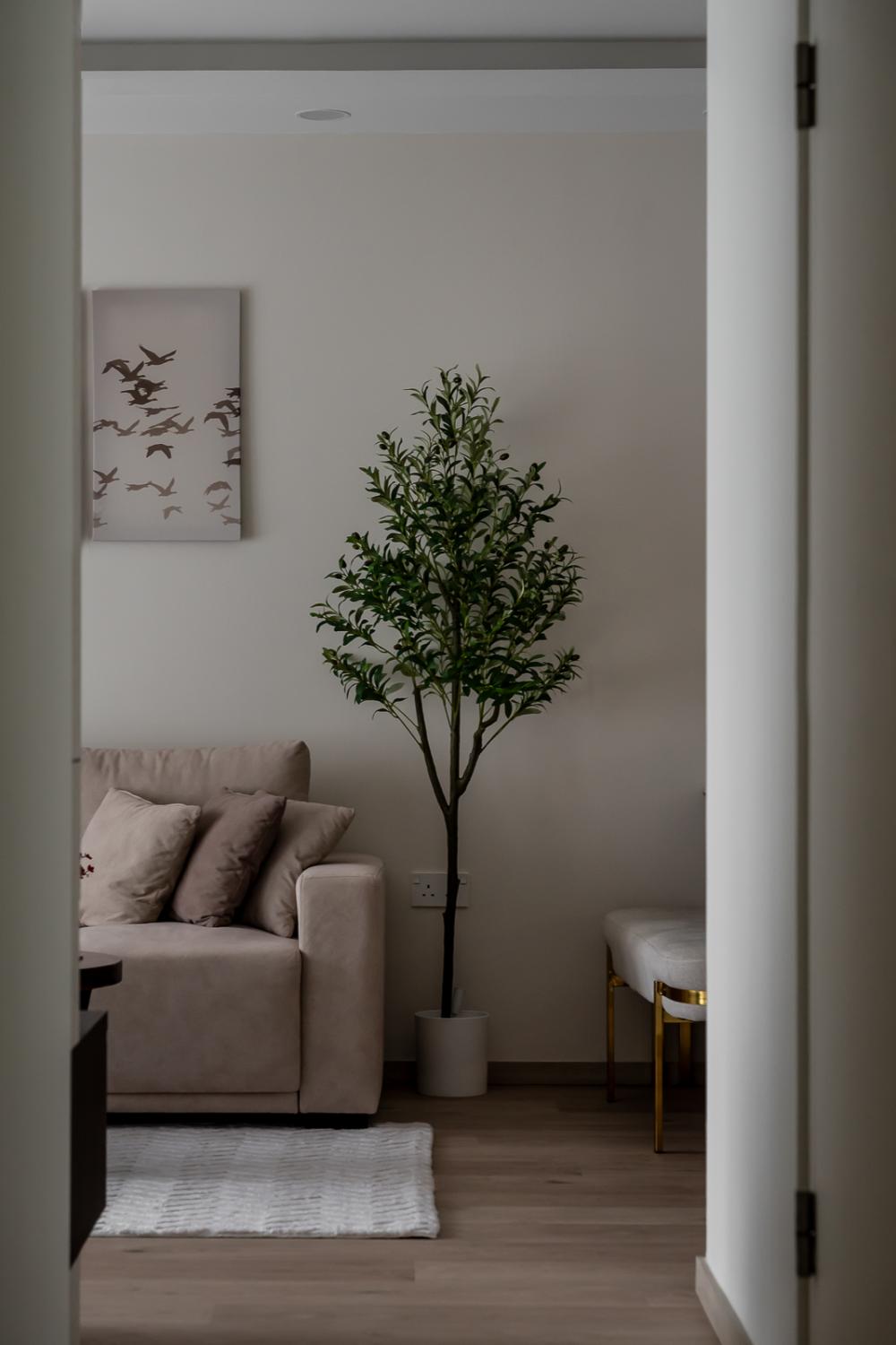 Transitional Living Room with Homogeneous Tiles and Downlights