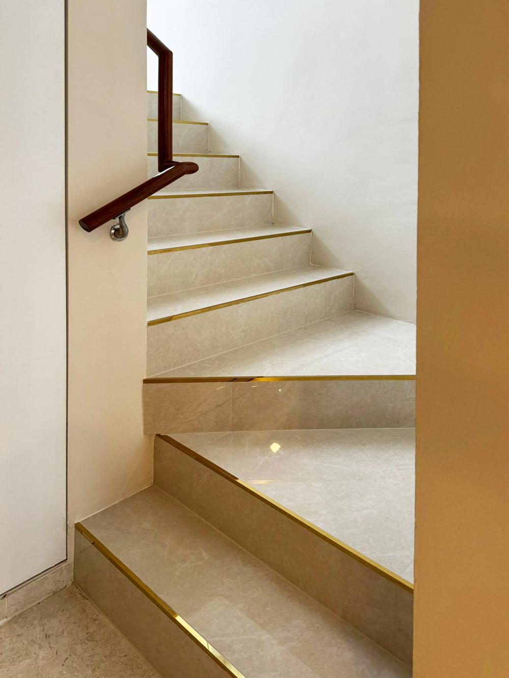 Modern Hallway with Bookshelf and Artwork