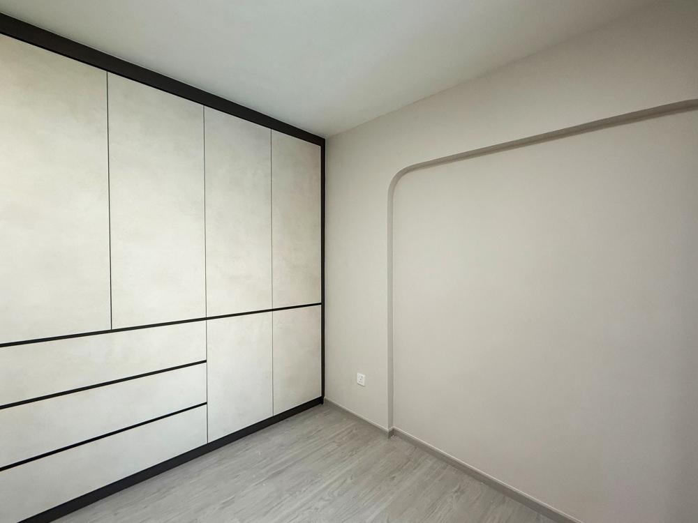 Minimalist Bedroom with Bookshelf and Platform Bed