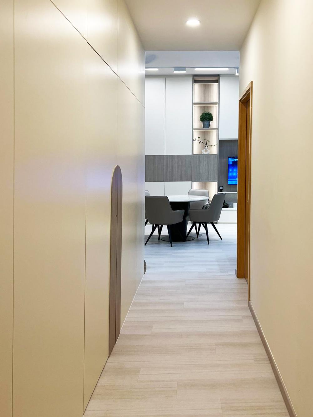 Modern Hallway with Bookshelf and Artwork