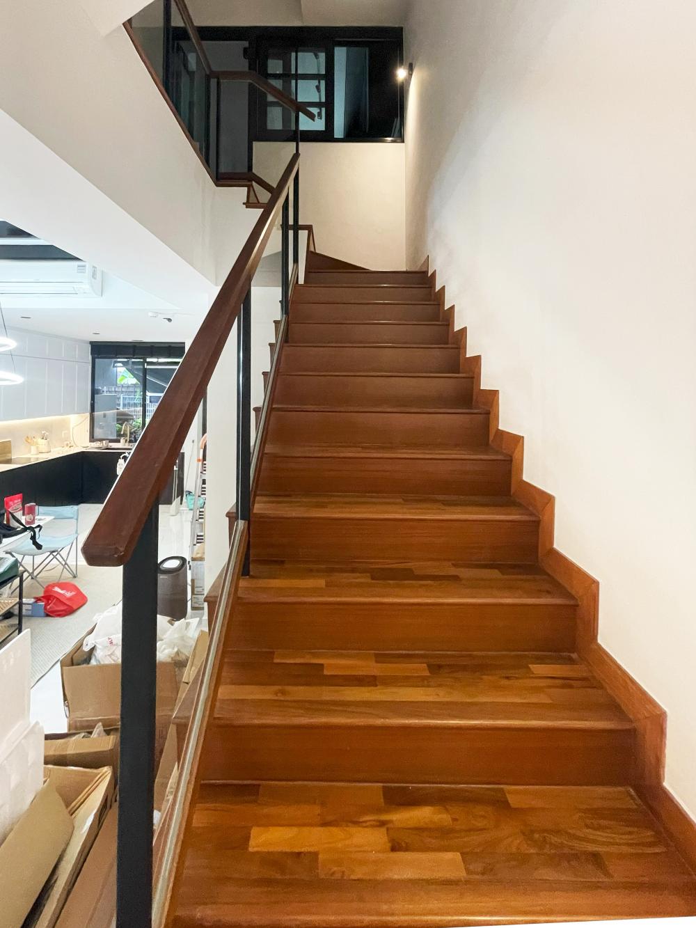 Modern Hallway with Bookshelf and Artwork