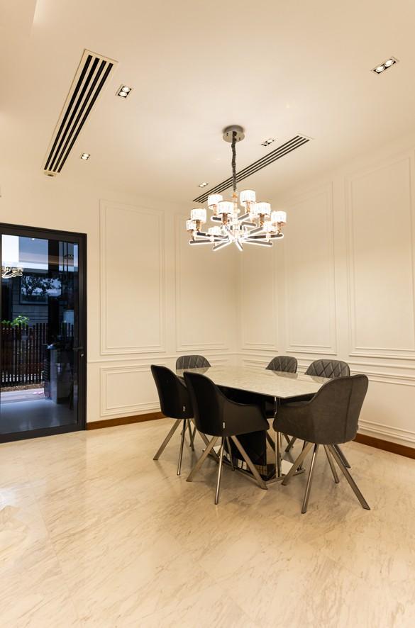 Transitional Dining Room with Chandelier and Downlights