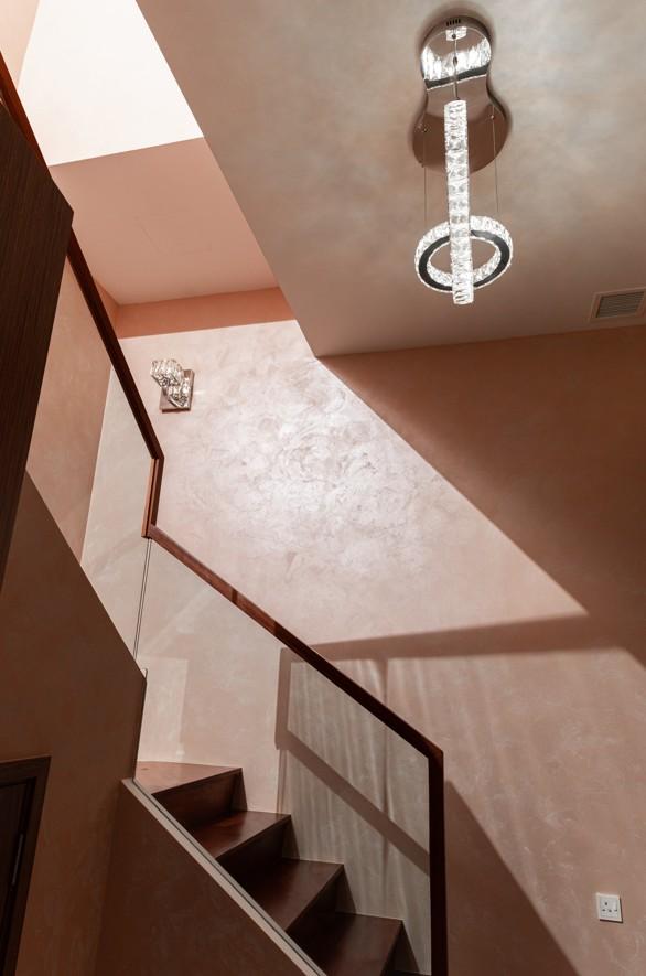 Transitional Hallway with Parquet Floor and Feature Wall