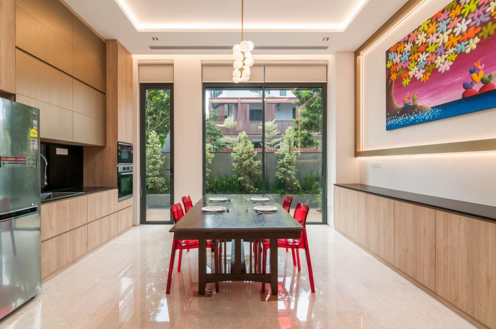 Asian Dining Room with Cove Lighting and Dining Table