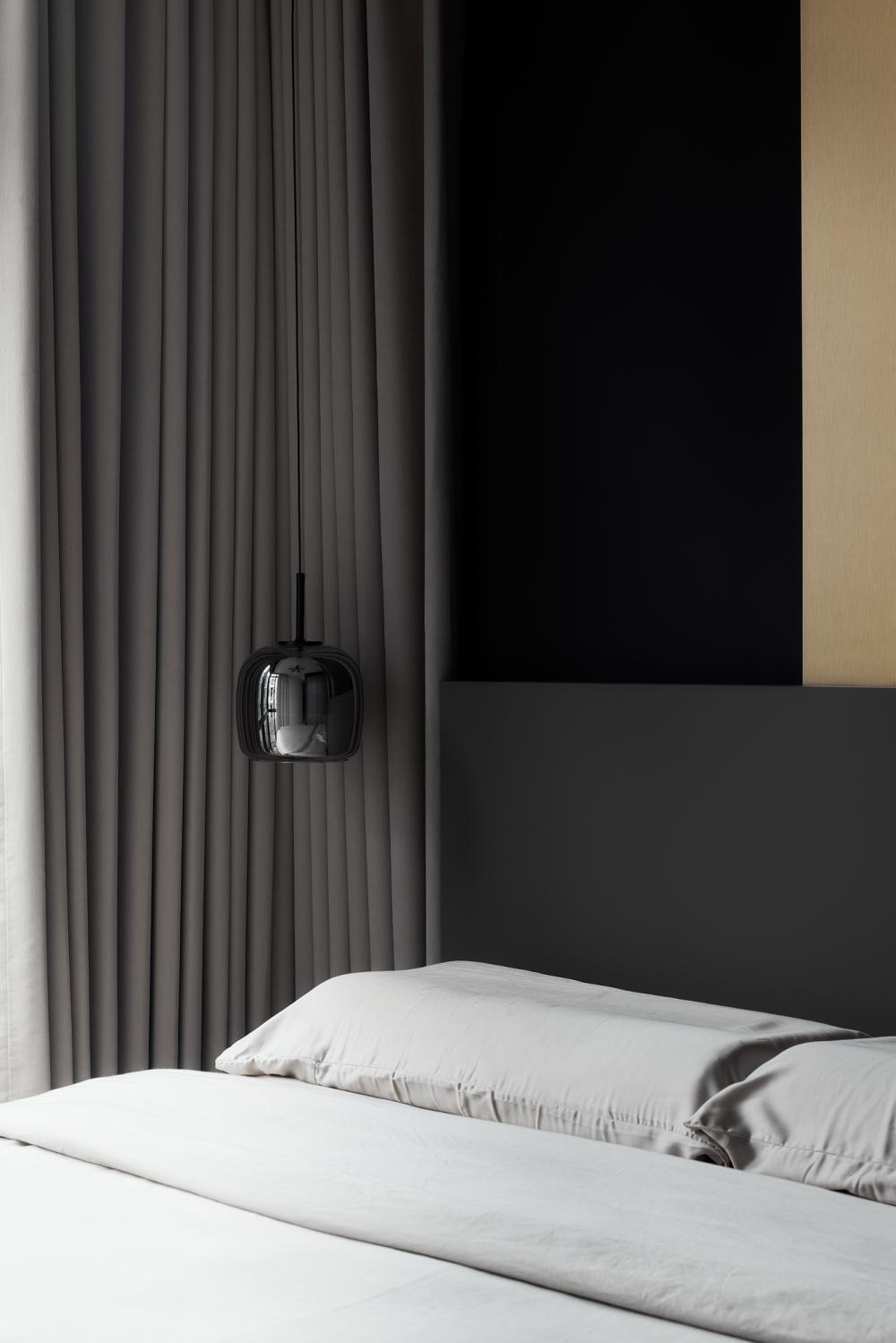 Modern Bedroom with Feature Wall and Drop Light