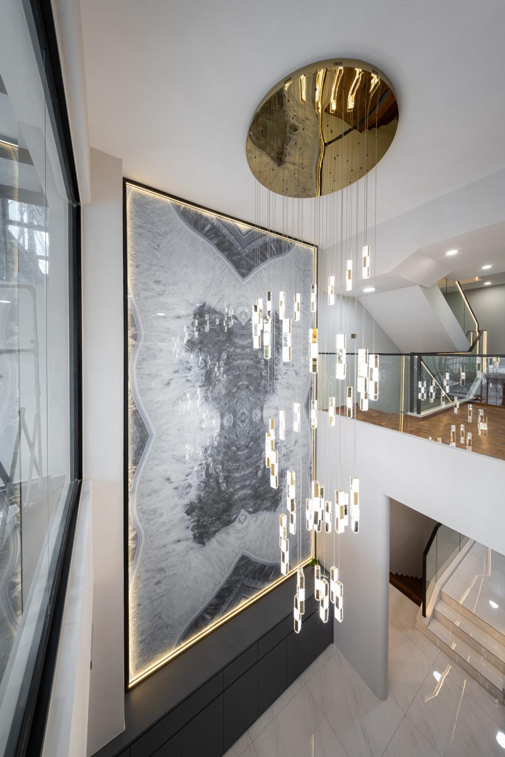Contemporary Entryway with Feature Wall and Staircase
