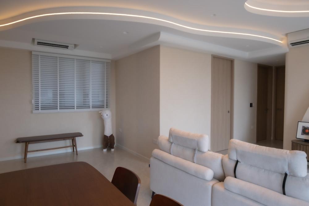 Minimalist Living Room with Cove Lighting and Roller Blinds