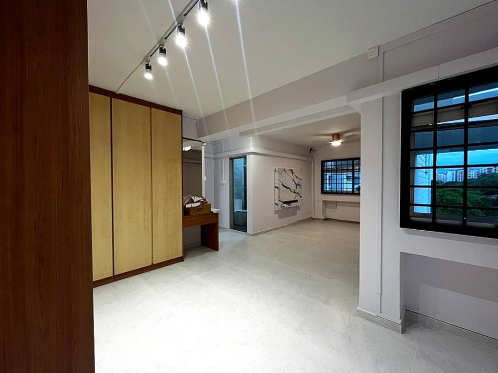 Modern Bedroom with TV Console and Ceiling Light