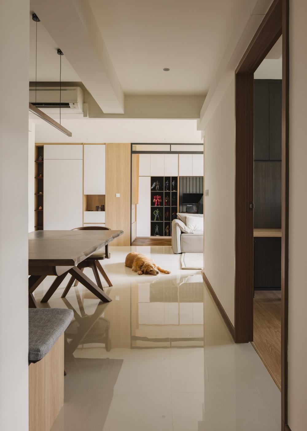 Contemporary Hallway with Bookshelf and Dining Table