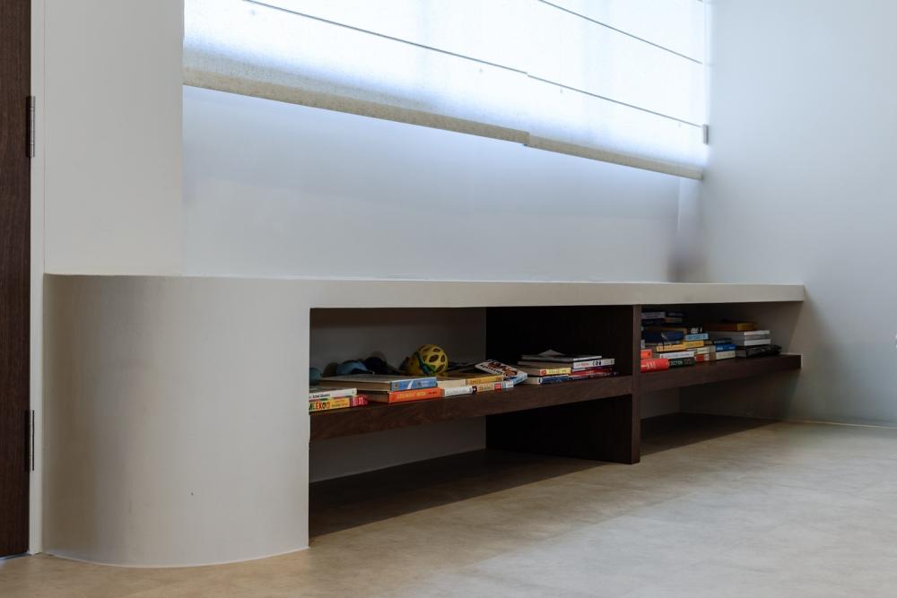 Contemporary Living Room with Bookshelf and Homogeneous Tiles