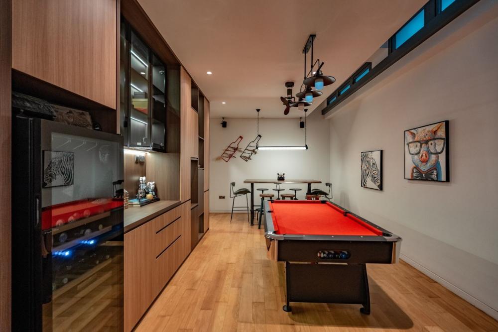 Modern Basement with Paintings and Storage Cabinets