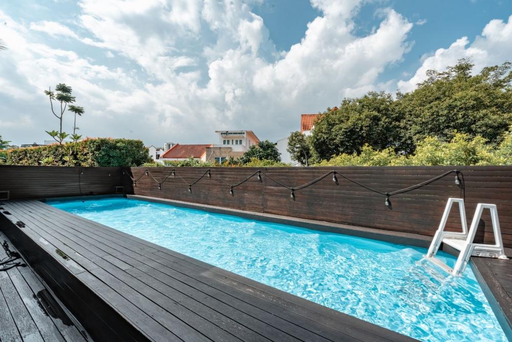 Modern Balcony with Outdoor Chairs and Swimming Pool