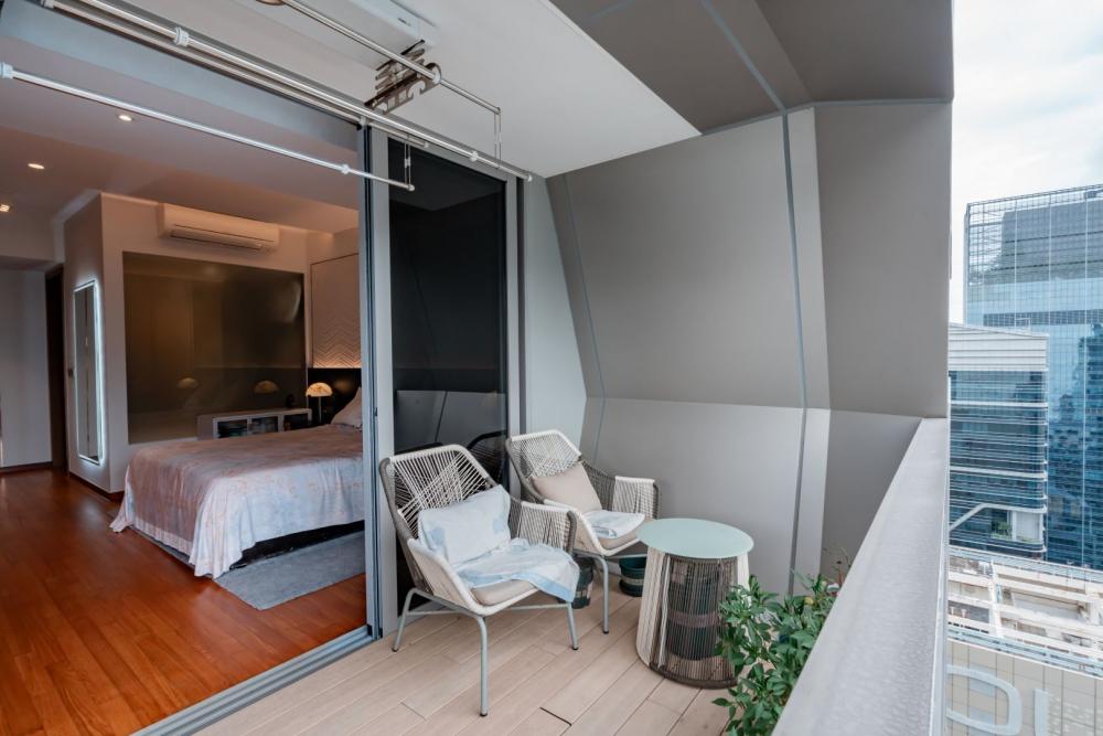 Modern Balcony with Outdoor Chairs and Houseplants