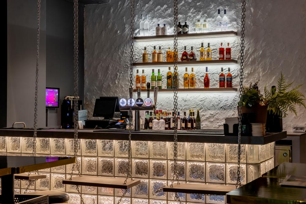 Modern Pub with Feature Wall and Bar Counter