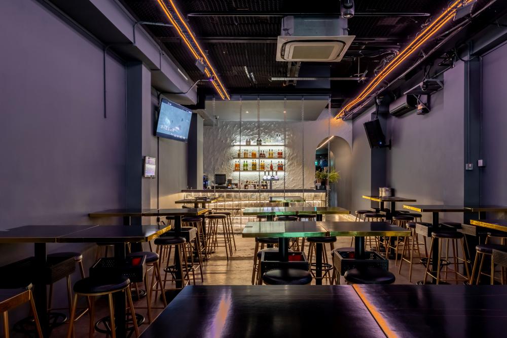 Modern Pub with Feature Wall and Bar Counter
