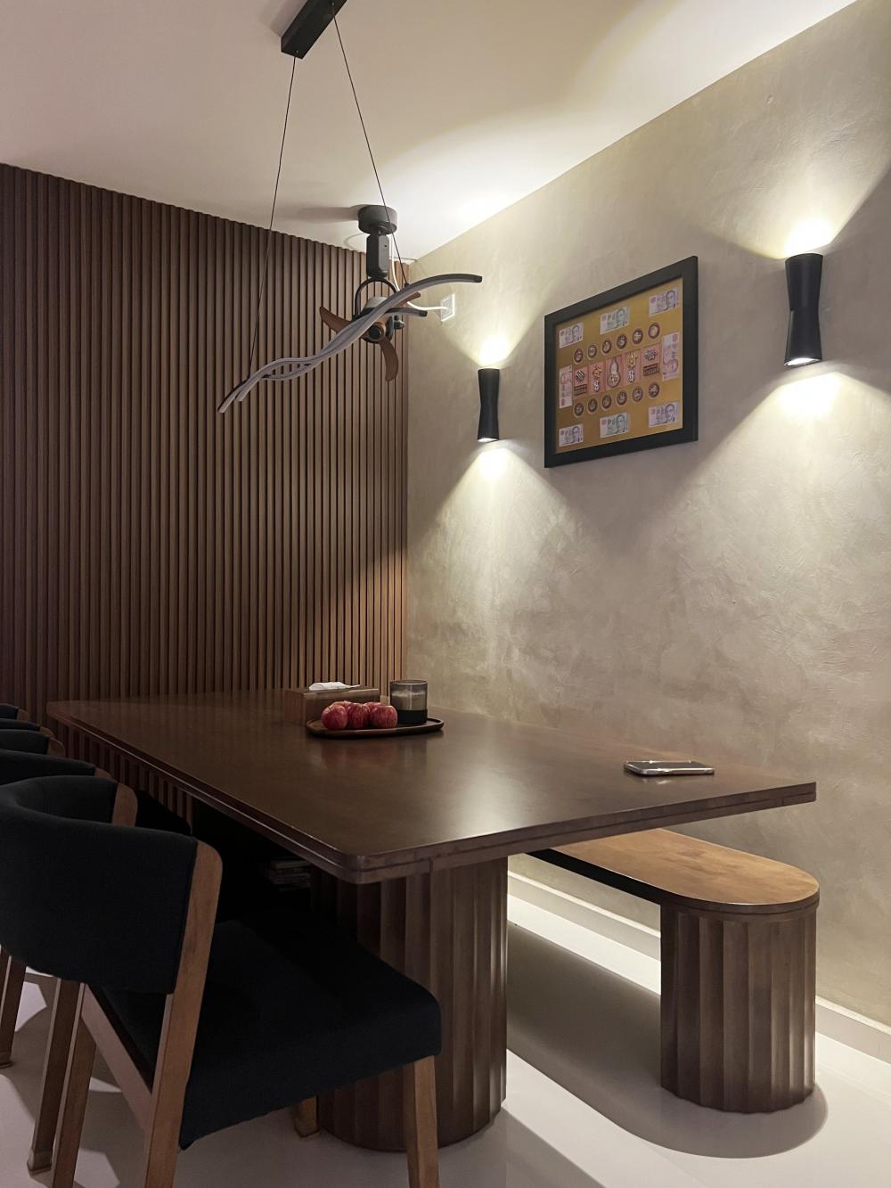 Minimalist Dining Room with Feature Wall and Drop Light