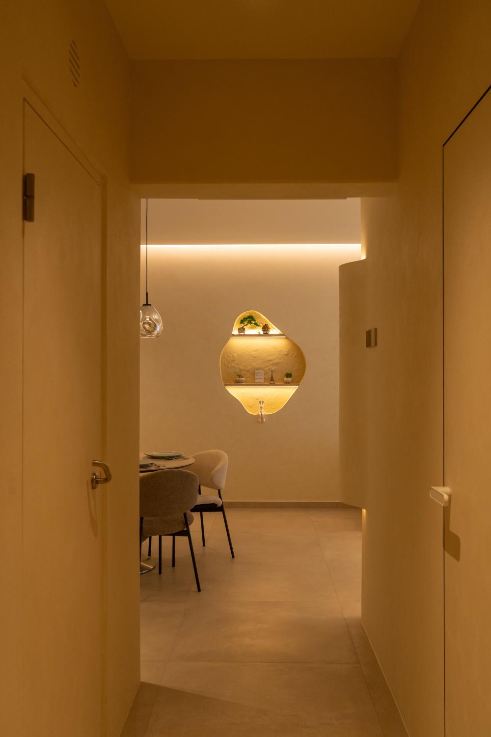Minimalist Foyer with Artwork and Planters