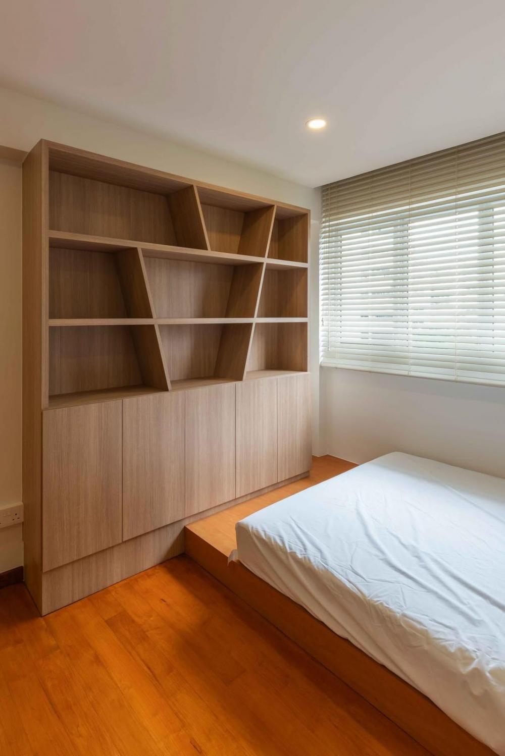 Minimalist Bedroom with Bookshelf and Platform Bed