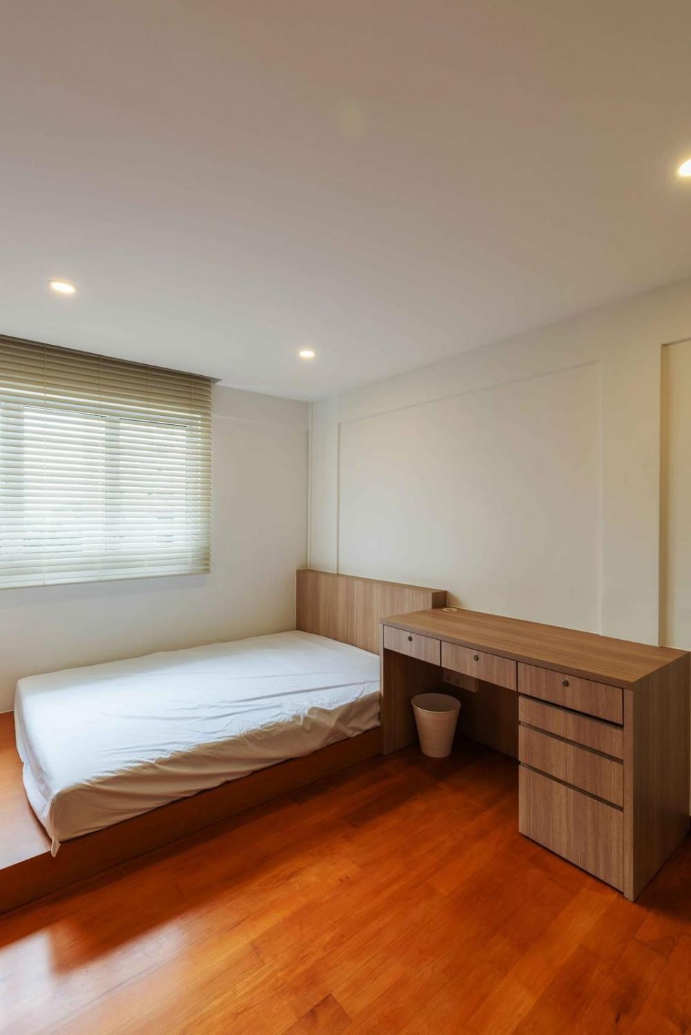 Minimalist Bedroom with Platform Bed and Parquet Floor