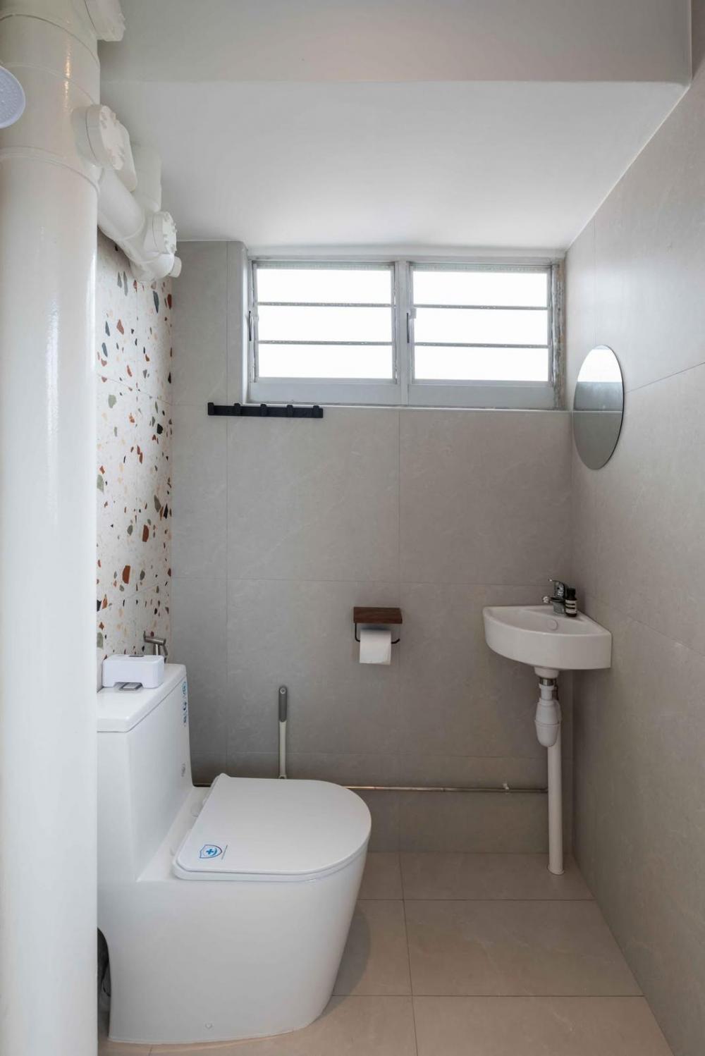 Minimalist Bathroom with Homogeneous Tiles and Bathroom Sinks