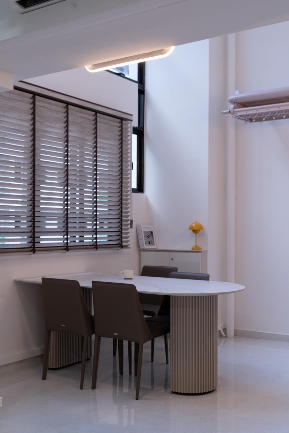 Minimalist Dining Room with Cove Lighting and Dining Table