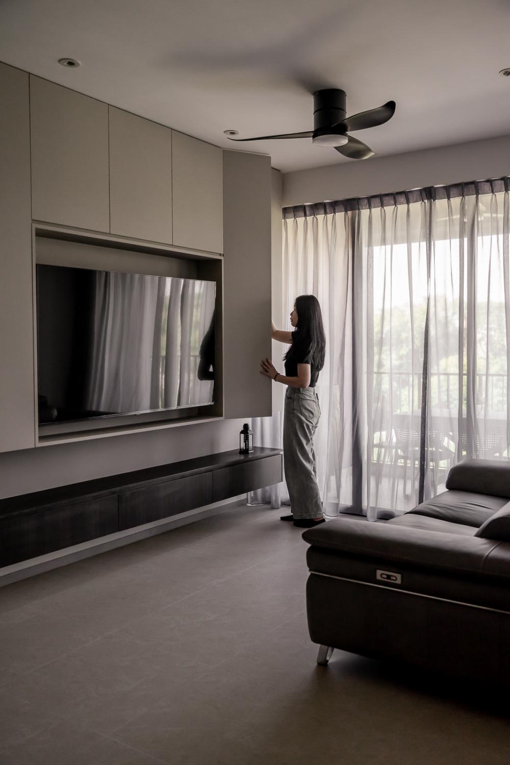 Modern Living Room with Bookshelf and Homogeneous Tiles