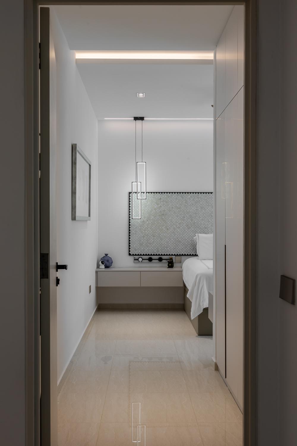 Modern Bedroom with Homogeneous Tiles and Cove Lighting